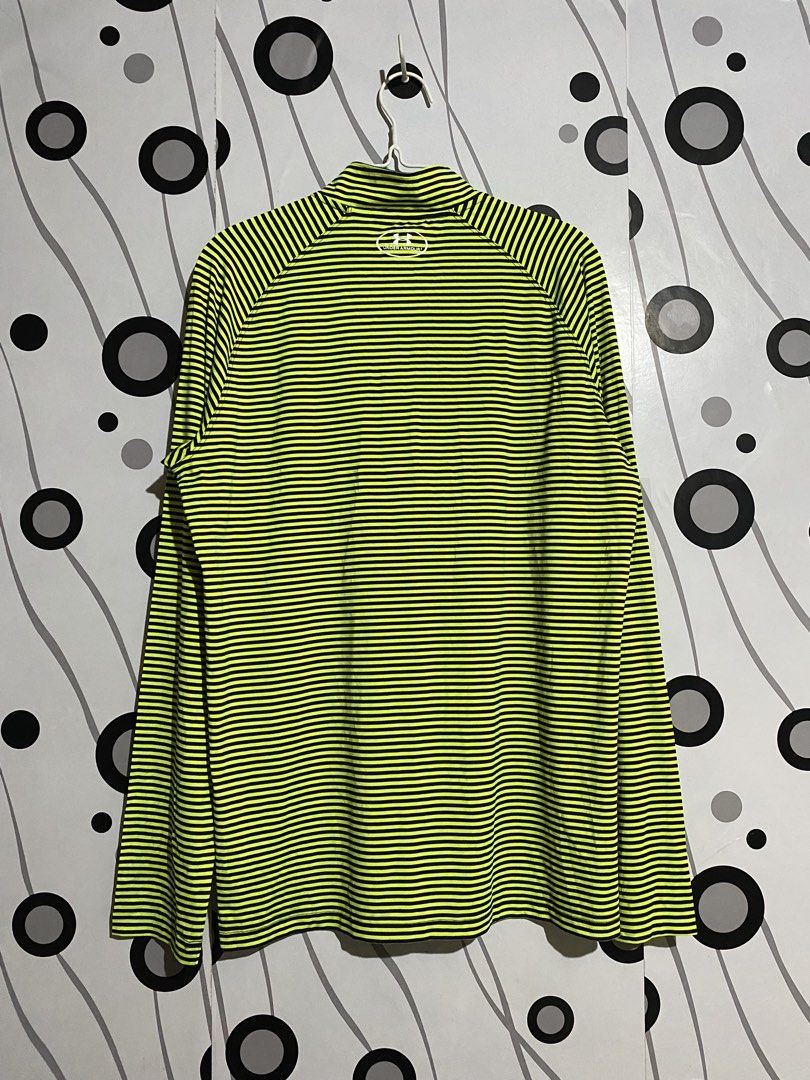 Under Armour long-sleeve, quarter-zip athletic top (Category: Activewear) located in Cebu City. Submitted by patspickph (Listing ID 1468787324, Image 3). Description: This is a neon yellow and dark/gray micro-striped Under Armour long-sleeve, quarter-zip athletic top with a mock neck and moisture-wicking HeatGear-style fabric. Size XXL on tag dimensions W22 L29.5. Good As New No issue Excellent Condition👍👌.