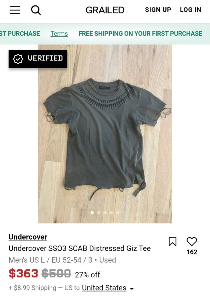 Undercover SS03 Scab Distressed Giz Tee (Category: Tshirts & Polo Shirts ) located in Naga. Submitted by secondspinv2 (Listing ID 1468862669, Image 2). Description: Undercover Spring/Summer 2003 "Scab" GIZ Destroyed Tee. Designed by Jun Takahashi, this heavily distressed piece features the signature tribal-inspired GIZ geometric pattern printed around the collar, complete with intentional pinholes, raw hems, and frayed edges reflecting punk cultu