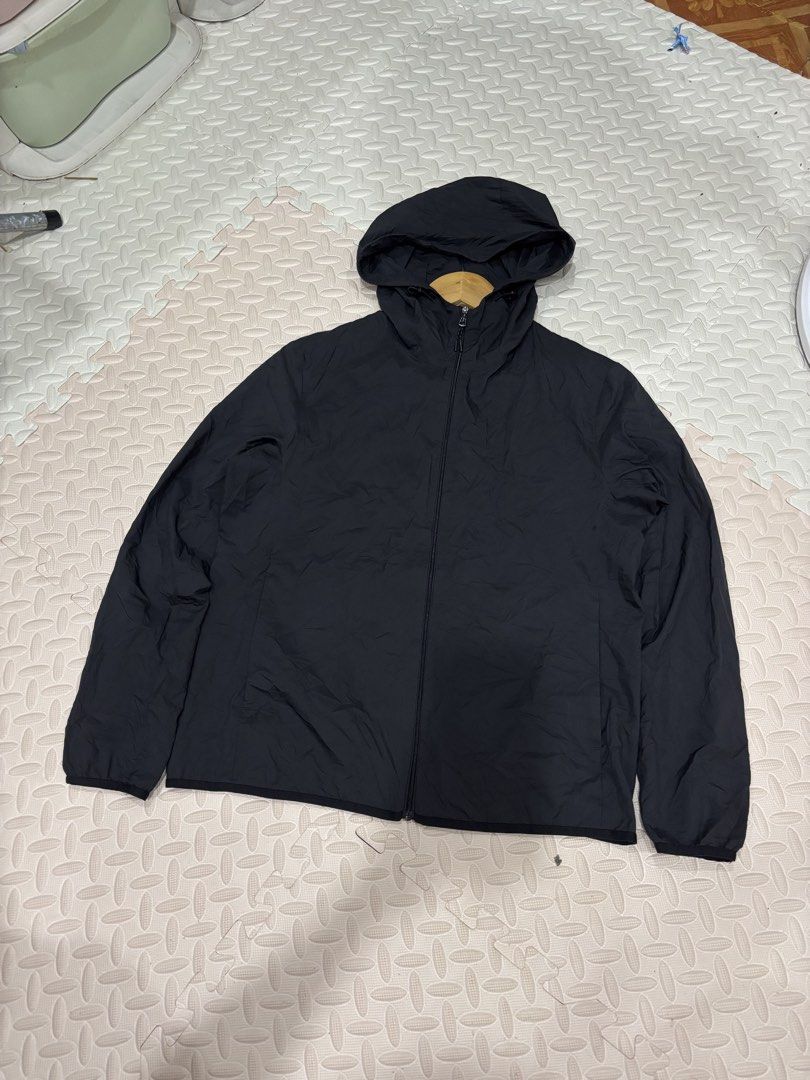 Uniqlo Black Hooded Windbreaker Jacket (Category: Coats, Jackets and Outerwear) located in Manila. Submitted by noribrahim.20 (Listing ID 1468873591, Image 1). Description: - Brand: Uniqlo - Color: Black - Size: Large (L) - Origin: Made in Indonesia - Material: Lightweight with comfortable mesh lining - Features: Full zip front, attached hood with drawstrings, two secure zippered side pockets - Condition: Clean, excellent overall condition with m
