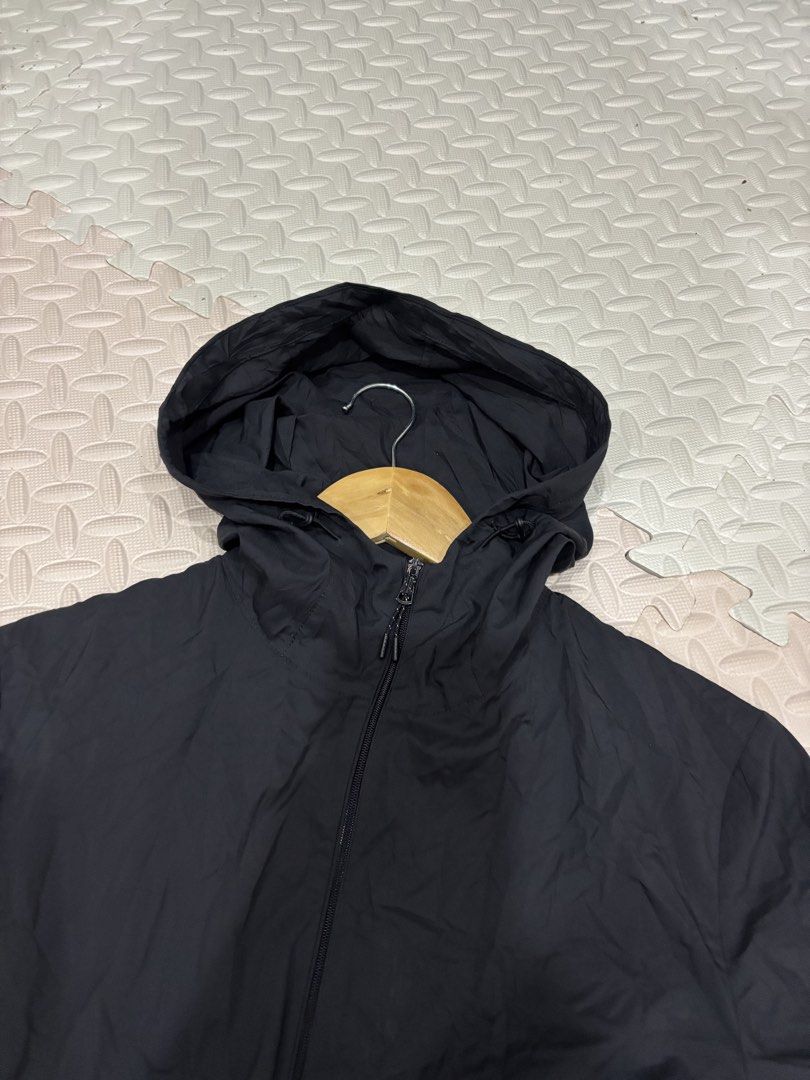 Uniqlo Black Hooded Windbreaker Jacket (Category: Coats, Jackets and Outerwear) located in Manila. Submitted by noribrahim.20 (Listing ID 1468873591, Image 2). Description: - Brand: Uniqlo - Color: Black - Size: Large (L) - Origin: Made in Indonesia - Material: Lightweight with comfortable mesh lining - Features: Full zip front, attached hood with drawstrings, two secure zippered side pockets - Condition: Clean, excellent overall condition with m