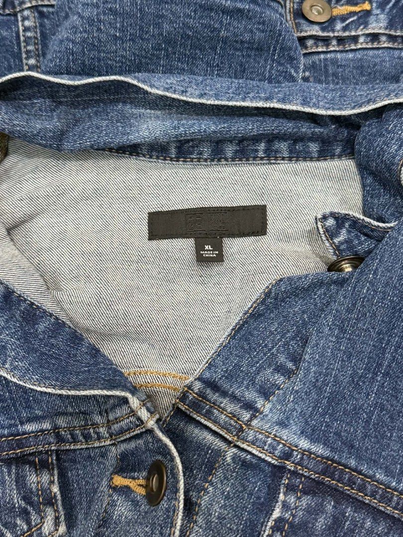 Uniqlo Blue Denim Jacket Size XL (Category: Coats, Jackets and Outerwear) located in Manila. Submitted by yncldo (Listing ID 1468789230, Image 2). Description: - Brand: Uniqlo - Item: Dark wash denim jacket - Size: XL - Details: Front button closures, dual chest flap pockets, classic collar, and button cuffs.