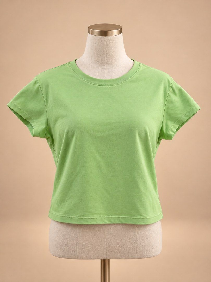 Uniqlo Cropped T-Shirt (Category: Shirts) located in Caloocan City. Submitted by joannarms320722 (Listing ID 1468779763, Image 1). Description: - Brand: Uniqlo - Color: Lime green / Pastel green - Size: XL - Material: Clean, comfortable cotton - Fit: Relaxed fit, cropped cut - Neckline: Round neckline with ribbed collar - Condition: Excellent basic tee, easy to style with high-waisted denim or shorts.
