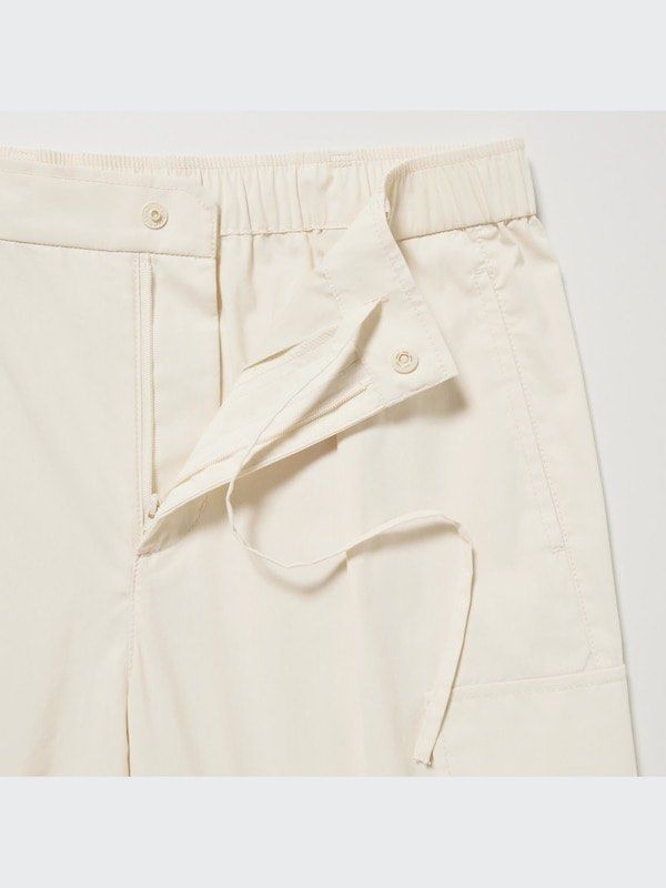Uniqlo Easy Cargo Pants (Category: Jeans) located in Quezon City. Submitted by cozykath (Listing ID 1468730762, Image 3). Description: - Uniqlo Beige Cargo Pants - Size: Medium - Waist: 63-69cm - Hip: 88-94cm - Material: Cotton/Nylon blend (body), Polyester/Cotton (pocket lining) - Features: Elastic waistband, drawstring - Condition: Visible yellow stains on fabric - Made in: China.