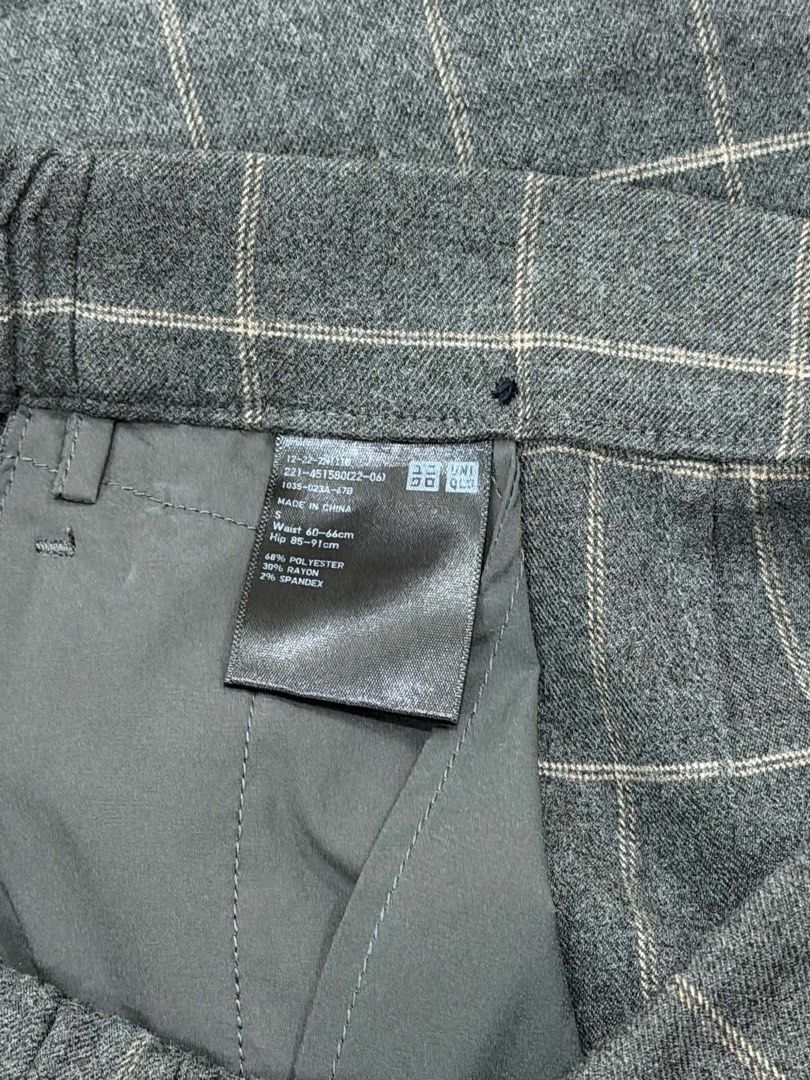 Uniqlo Grey Plaid Check Skort Size S (Category: Skirts) located in Manila. Submitted by yncldo (Listing ID 1468789503, Image 2). Description: - Brand: Uniqlo - Item: Grey plaid wrap skort with single black button closure - Size: S (Waist: 60-66cm, Hips: 85-91cm) - Material: 68% polyester, 30% rayon, 2% spandex (soft flannel-like texture) - Condition: Clean inside and out, excellent everyday wear.
