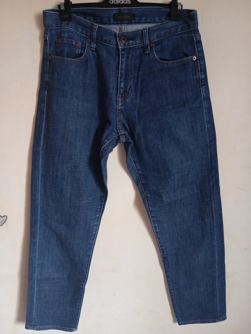 Uniqlo Jeans Dark Blue (Category: Jeans) located in Cabanatuan. Submitted by w3ng.gay (Listing ID 1468751052, Image 1). Description: - Brand: Uniqlo - Color: Dark blue with clean wash and contrast stitching - Size: Tag size 24 (Waist: 61 cm) - Fit: Mid-rise waist - Style: Classic five-pocket design with button and zip fly closure - Material: Slight stretch for added comfort .