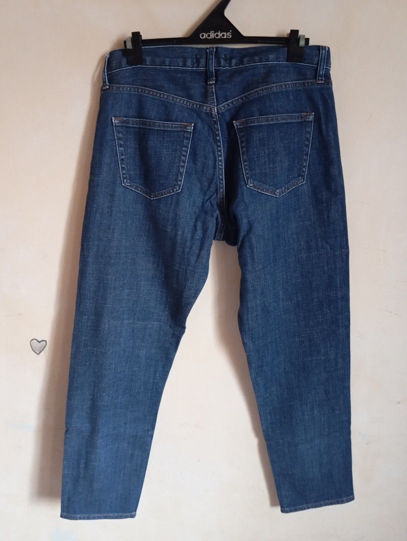 Uniqlo Jeans Dark Blue (Category: Jeans) located in Cabanatuan. Submitted by w3ng.gay (Listing ID 1468751052, Image 2). Description: - Brand: Uniqlo - Color: Dark blue with clean wash and contrast stitching - Size: Tag size 24 (Waist: 61 cm) - Fit: Mid-rise waist - Style: Classic five-pocket design with button and zip fly closure - Material: Slight stretch for added comfort .