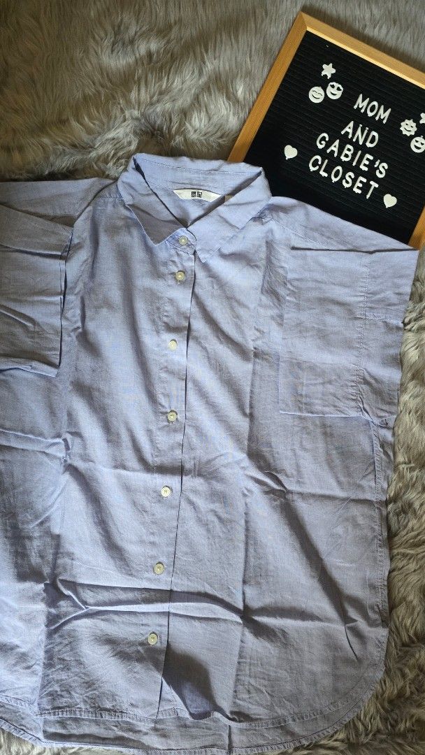 Uniqlo Light Blue Button-Up Shirt Medium (Category: Tshirts & Polo Shirts ) located in Cabanatuan. Submitted by belle_1013 (Listing ID 1468762986, Image 1). Description: - Brand: Uniqlo - Color: Light Blue - Size: Medium (tag on collar) - Style: Classic collared neckline with front button closure - Material: Lightweight fabric - Condition: Good overall condition, perfect for casual wear or layering.