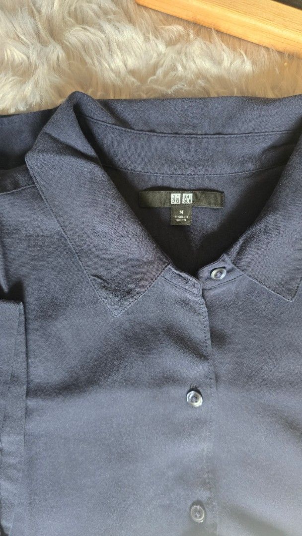 Uniqlo Navy Blue Collared Shirt Size M (Category: Shirts) located in Cabanatuan. Submitted by belle_1013 (Listing ID 1468762020, Image 2). Description: - Brand: Uniqlo - Color: Navy Blue - Size: Medium - Style: Long sleeves, button-up front, structured collar - Condition: Classic piece, made in China - Perfect for casual or smart-casual wear.
