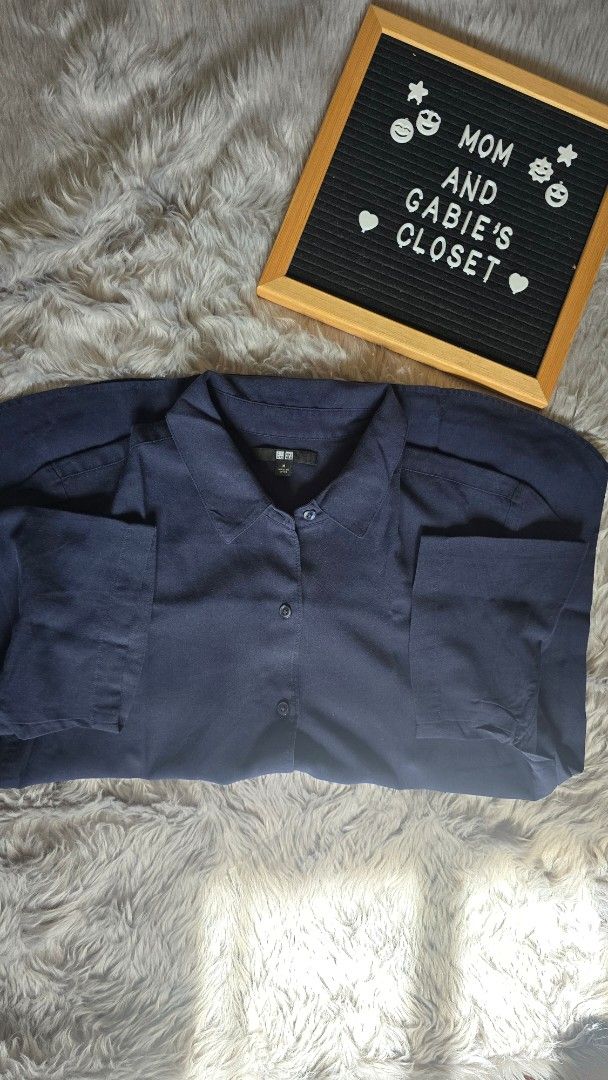 Uniqlo Navy Blue Collared Shirt Size M (Category: Shirts) located in Cabanatuan. Submitted by belle_1013 (Listing ID 1468762020, Image 1). Description: - Brand: Uniqlo - Color: Navy Blue - Size: Medium - Style: Long sleeves, button-up front, structured collar - Condition: Classic piece, made in China - Perfect for casual or smart-casual wear.