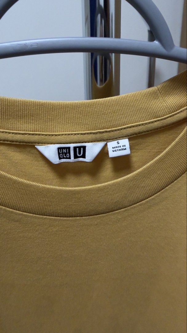 Uniqlo T-Shirt Size S (Category: Shirts) located in Manila. Submitted by rare_closetcleanout (Listing ID 1468802167, Image 2). Description: - Brand/Model: Uniqlo U Crew Neck T-Shirt - Color: Mustard Yellow - Size: Small - Material: Soft Cotton - Origin: Made in Vietnam - Fit: Relaxed fit with stylish side hem slits - Condition/Use: Great basic piece for everyday casual outfits Pls arrange your own lalamove loc. BGC .