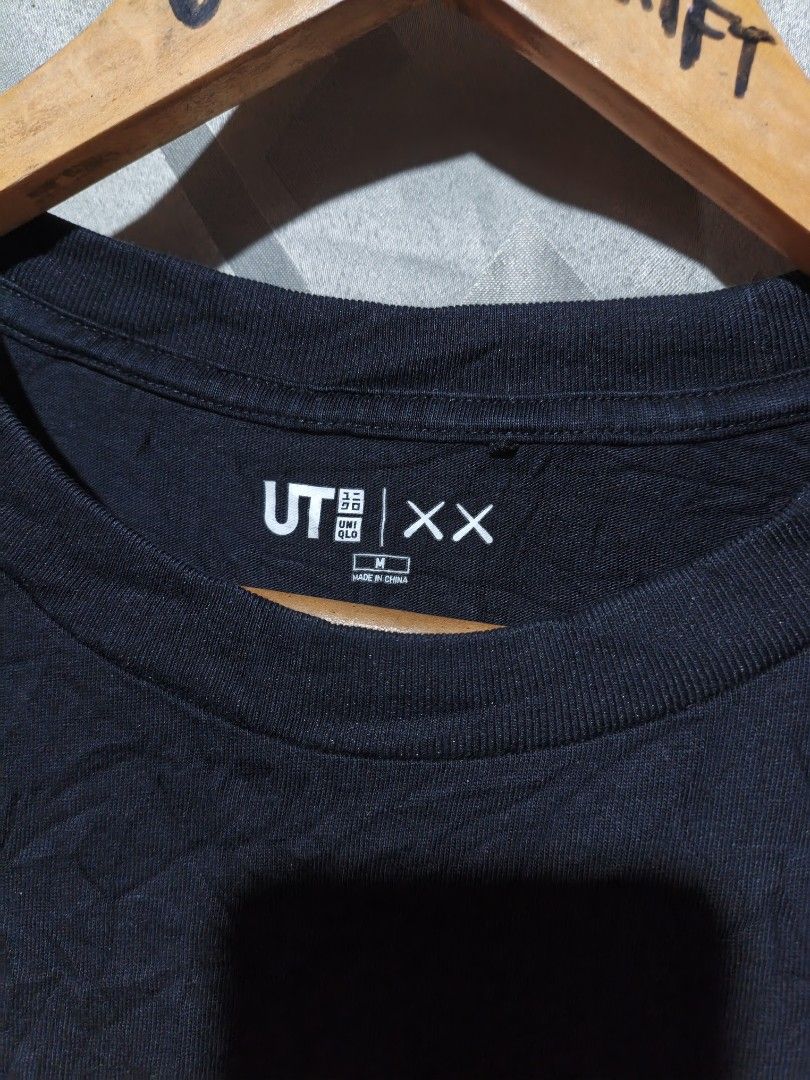 UNIQLO x KAWS UT Black Graphic Tee (Category: Shirts) located in Maasim. Submitted by ukayganda25 (Listing ID 1468771002, Image 3). Description: - Brand/Collab: UNIQLO UT x KAWS - Color: Black - Size: Medium (Measures approx. 20.5" x 26") - Material: 100% Cotton, Made in China - Design: Iconic Companion graphic on the front, signature XX logo on the back collar.