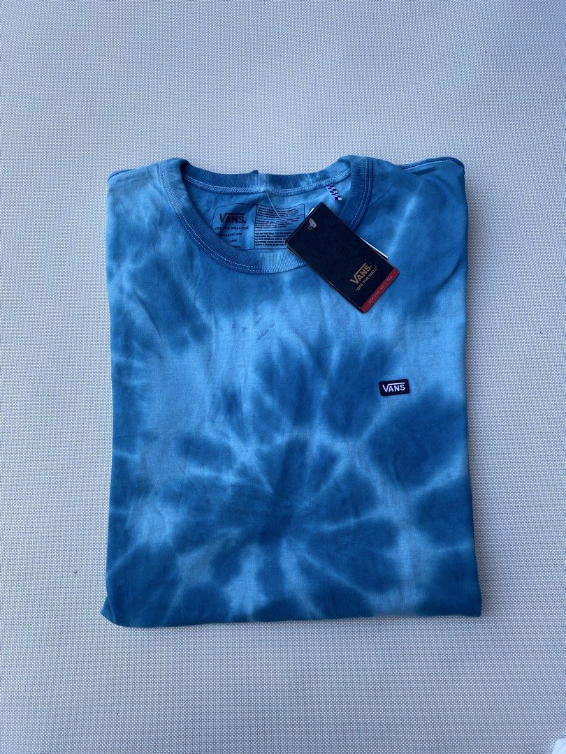Vans Tie Dye Classic Fit T-Shirt Blue (Category: Tshirts & Polo Shirts ) located in Tagum. Submitted by waaap420 (Listing ID 1468896708, Image 1). Description: - Brand: Vans - Style: Classic fit, relaxed silhouette t-shirt - Color/Pattern: Blue tie-dye with a clean gradient indigo wash - Details: Short sleeves, round crew neckline, small embroidered Vans logo patch on the left chest - Condition: Brand new with original paper hang tags attached - 