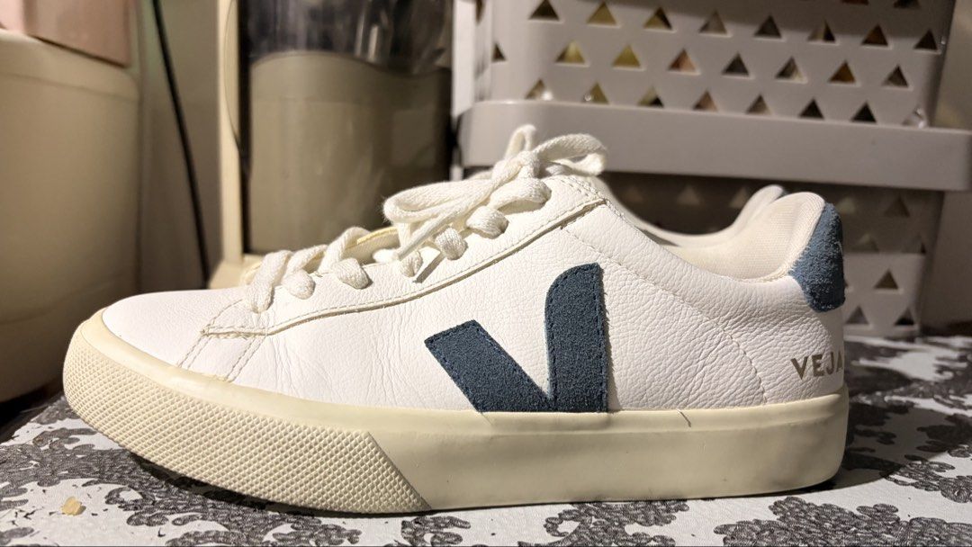 Veja Campo White Navy Leather Sneakers (Category: Sneakers) located in Manila. Submitted by leayah1990 (Listing ID 1468858234, Image 3). Description: - Brand: Veja - Colorway: White leather with navy blue suede logo and heel patch - Material: Premium white leather upper, suede accents, and off-white rubber sole - Features: Textured toe caps, clean white cotton laces - Condition: Clean upper with minor, normal wear on the soles - Style: Classic, m