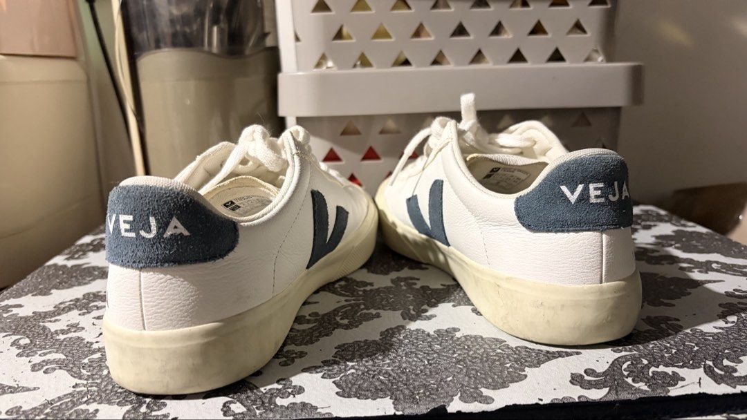 Veja Campo White Navy Leather Sneakers (Category: Sneakers) located in Manila. Submitted by leayah1990 (Listing ID 1468858234, Image 2). Description: - Brand: Veja - Colorway: White leather with navy blue suede logo and heel patch - Material: Premium white leather upper, suede accents, and off-white rubber sole - Features: Textured toe caps, clean white cotton laces - Condition: Clean upper with minor, normal wear on the soles - Style: Classic, m