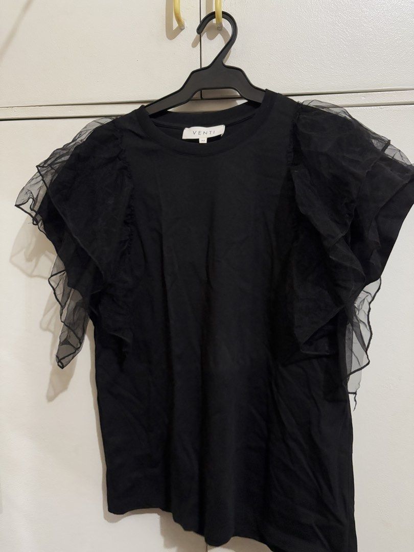 VENTI Black Blouse with Mesh Ruffle Sleeves Size M (Category: Blouses) located in Bulacan. Submitted by hey_alyyy (Listing ID 1468718754, Image 1). Description: - Brand: Venti - Size: Medium - Color: Black - Material: Soft 85% cotton body with mesh and tulle ruffle shoulder details - Neckline: Crew neck - Style: Great for elevating everyday casual outfits.