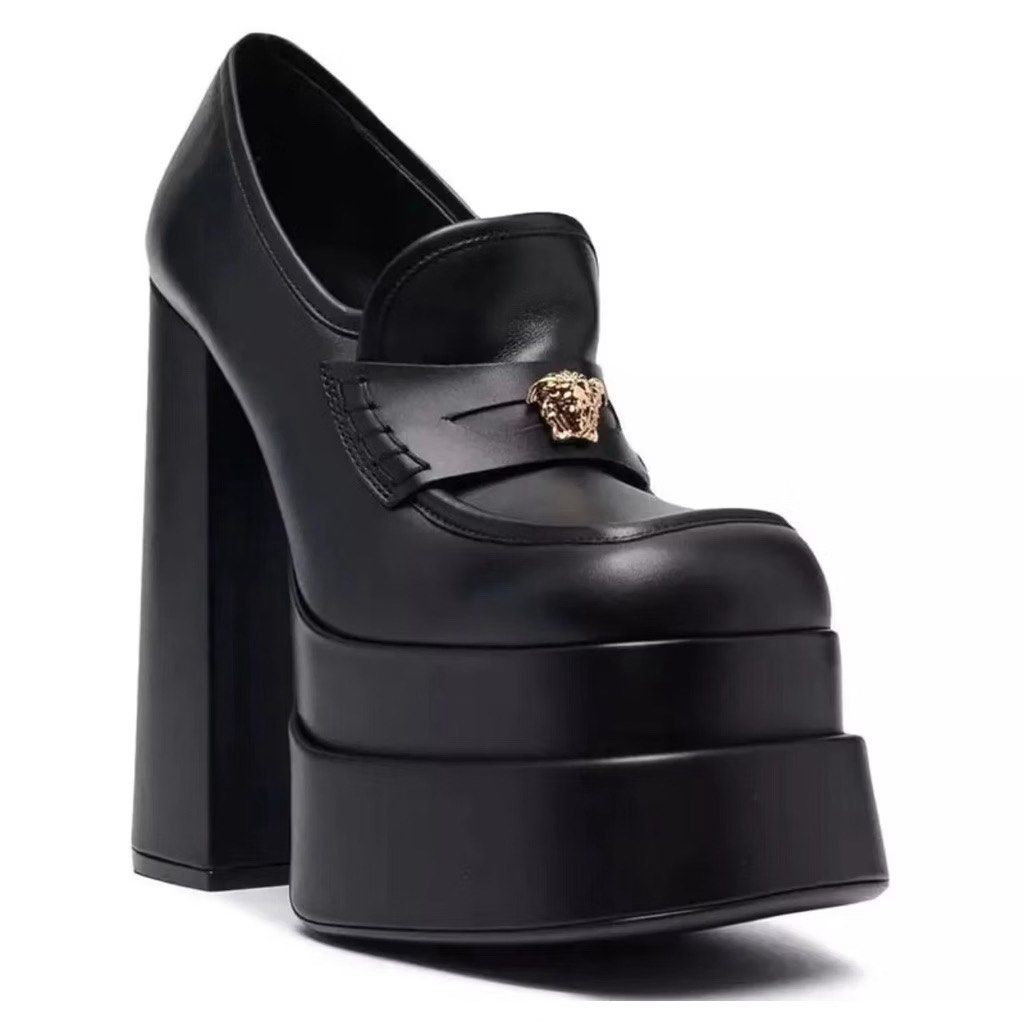 Versace Black Medusa Double Platform Loafers (Category: Loafers) located in Taytay. Submitted by theziatique (Listing ID 1468914885, Image 1). Description: Black leather loafers from Versace. Massive double platform sole paired with a chunky block heel. Gold-tone Medusa hardware on the strap across the front. Slip-on design with a square toe shape. Statement footwear piece..