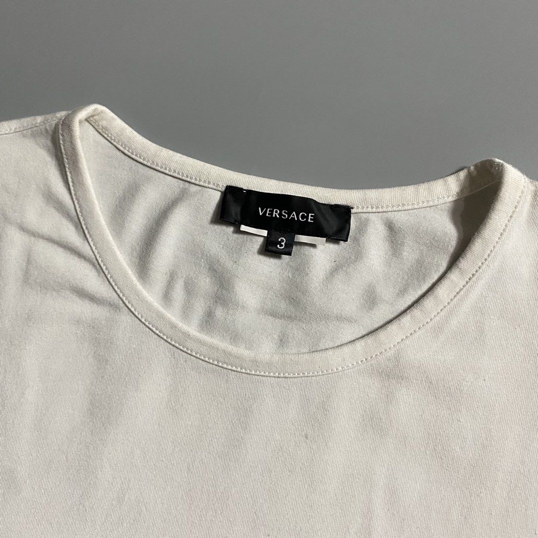 Versace Medusa White T-shirt (Category: Tshirts & Polo Shirts ) located in Manila. Submitted by curatedvg. (Listing ID 1468830101, Image 3). Description: Width: 18.5 inches Length: 27 inches Size S - M (slim fit) Excellent condition Cut care tag No stains or pinholes Color rate: 9/10 .