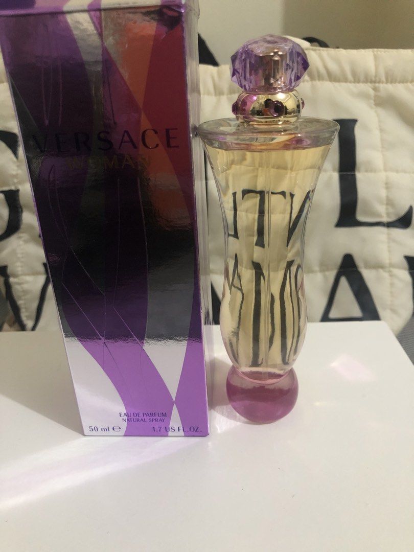 Versace Woman Eau de Parfum 50ml (Category: Fragrance & Deodorants) located in Bulacan. Submitted by kkaye_ (Listing ID 1468826794, Image 3). Description: - Brand: Versace Woman - Type: Eau de Parfum Spray - Volume: 50 ml / 1.7 US fl. oz. - Condition: Brand new, unsealed but unused (bottle and box shown in photos) - Packaging: Comes with original purple and cream patterned box - Fragrance Profile: Beautiful floral scent, ideal for daily wear - Pe
