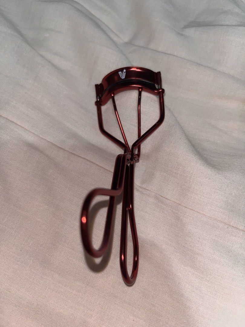 Vice Cosmetics Lifted & Curled Lash Curler (Category: Makeup) located in Manila. Submitted by cami0612 (Listing ID 1468872759, Image 2). Description: - Brand: Vice Co. Lifted & Curled lash curler - Color: Eye-catching metallic red finish - Condition: Like new (Used twice) - Inclusions: Original box and 1 brand new, sealed spare silicone pad.