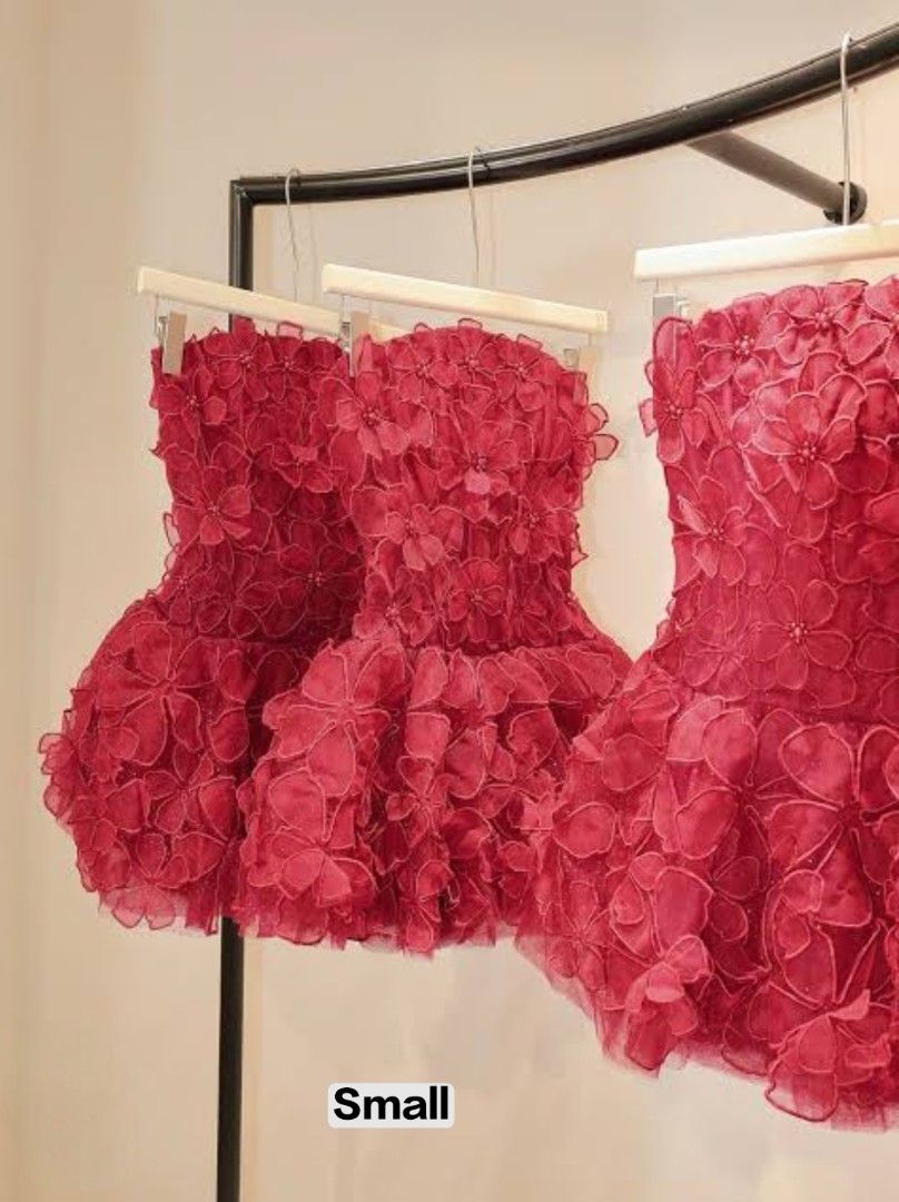 Vietnam Forda Dress (Category: Dresses) located in Las Pinas. Submitted by lodss91453 (Listing ID 1468920758, Image 1). Description: - Color: Bright red - Size: Small (S) - Style: Strapless mini dress with fitted bodice and voluminous flared skirt - Details: Covered entirely in eye-catching 3D floral appliques with a structured shape - Occasion: Ideal for parties, weddings, or formal events - Condition: Great statement piece, vibrant and ready to