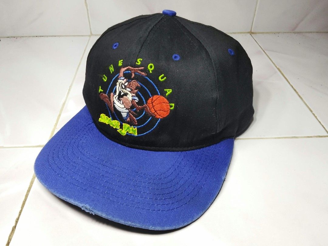 Vintage 1996 Space Jam Taz Tune Squad Snapback Cap (Category: Caps & Hats) located in Aroroy. Submitted by pinaskaboo (Listing ID 1468754927, Image 1). Description: - Vintage 1996 Space Jam snapback by Fresh Caps - Classic black crown with a contrasting royal blue brim - Front features embroidered Tazmanian Devil and Tune Squad lettering - Authentic Warner Bros tag inside - 100% cotton material - One size fits all with adjustable snapback closure