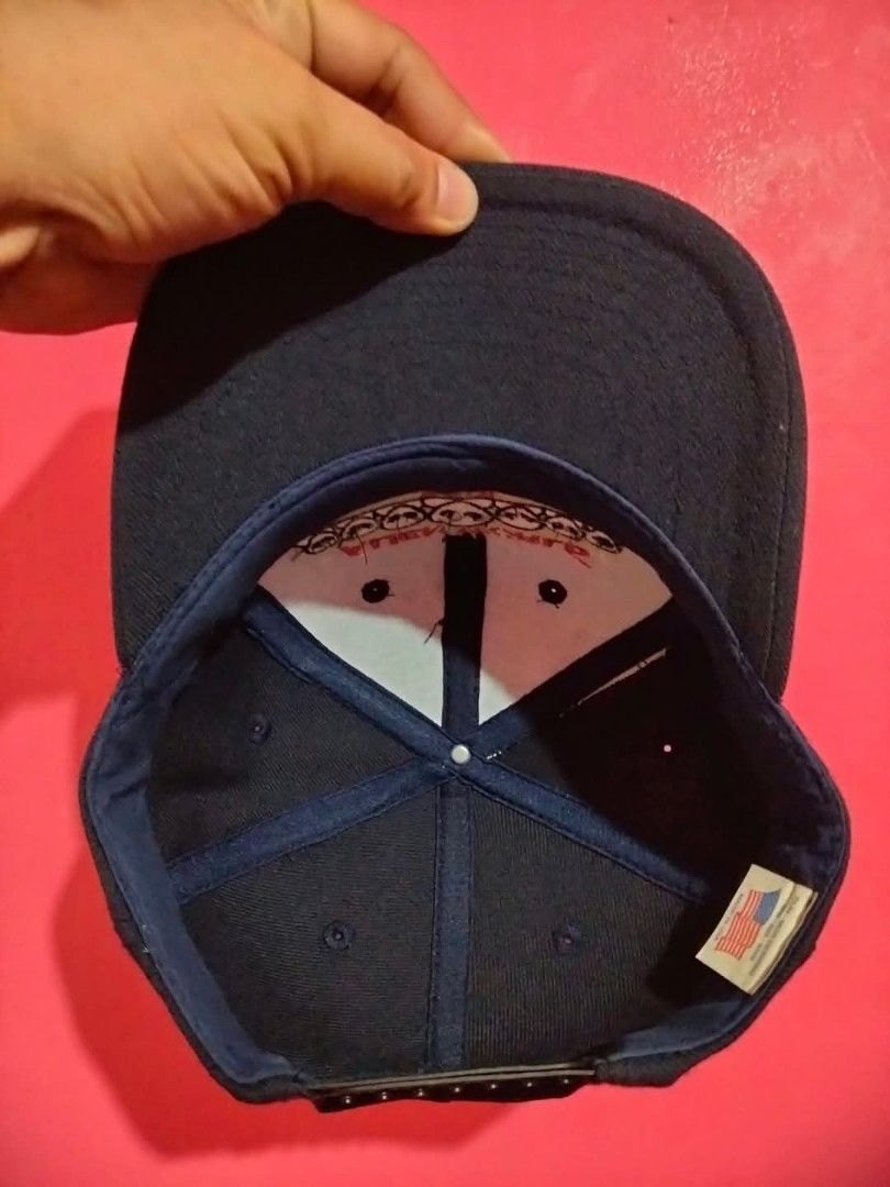 Vintage Alien World Global Takeover Snapback Hat (Category: Caps & Hats) located in Mangaldan. Submitted by niftythrifty69 (Listing ID 1468781387, Image 2). Description: - Brand: Dun-Mor Designs (Made in USA, 2001 vintage) - Design: Embroidered 'Alien World Global Takeover' with red and white alien details - Color: Classic black - Fit: Adjustable plastic snapback closure - Condition: Clean structure, ready to wear - Style: Retro streetwear.