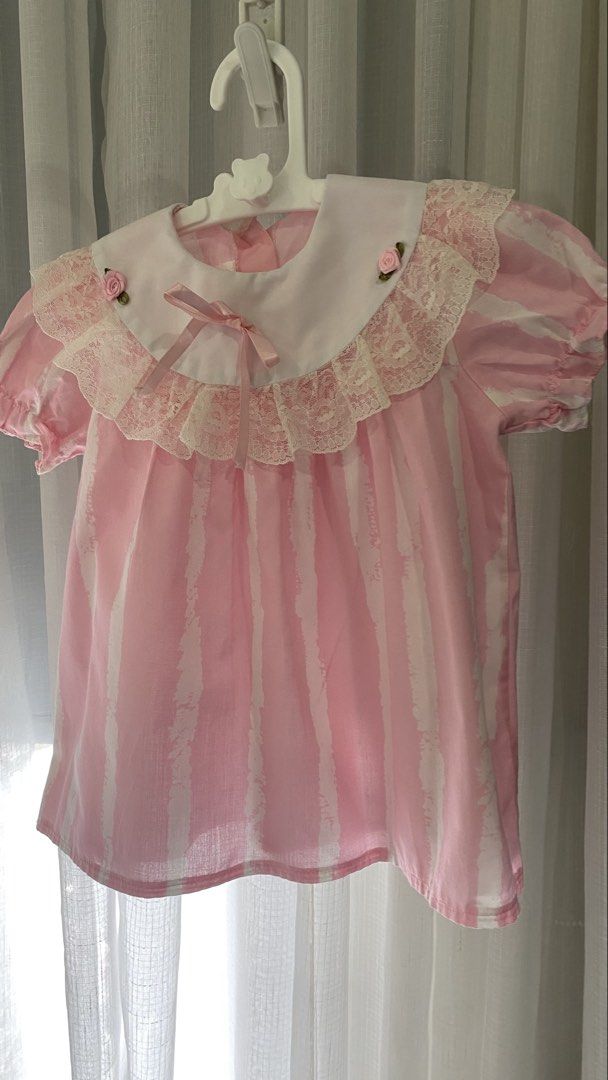 vintage dress ✿ (Category: Babies & Kids Fashion) located in Manila. Submitted by louiesalvador (Listing ID 1468717139, Image 1). Description: size: 24 months on tag, but runs small. fits 6-9 months, can fit til 12 if petite (estimated) • brand: unknown • like new • pastel pink and white stripes • rounded collar with delicate lace • two tiny pink rosettes attached on the collar • pink satin ribbon at the center of the neckline.