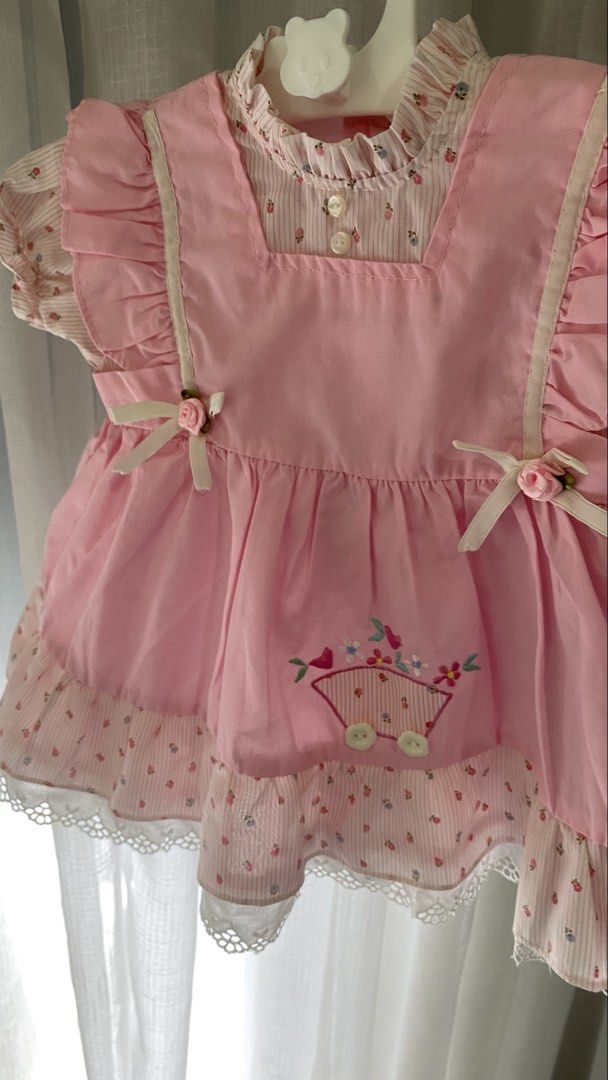vintage dress ✿ (Category: Babies & Kids Fashion) located in Manila. Submitted by louiesalvador (Listing ID 1468717425, Image 2). Description: size: 12 months on tag • brand: mini togs • like new • pastel pink and white striped base fabric with floral prints • built-in bubblegum pink apron • embroidered wagon with small flowers.