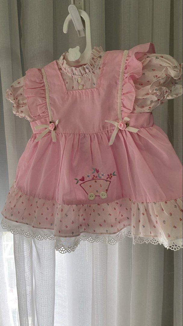 vintage dress ✿ (Category: Babies & Kids Fashion) located in Manila. Submitted by louiesalvador (Listing ID 1468717425, Image 1). Description: size: 12 months on tag • brand: mini togs • like new • pastel pink and white striped base fabric with floral prints • built-in bubblegum pink apron • embroidered wagon with small flowers.