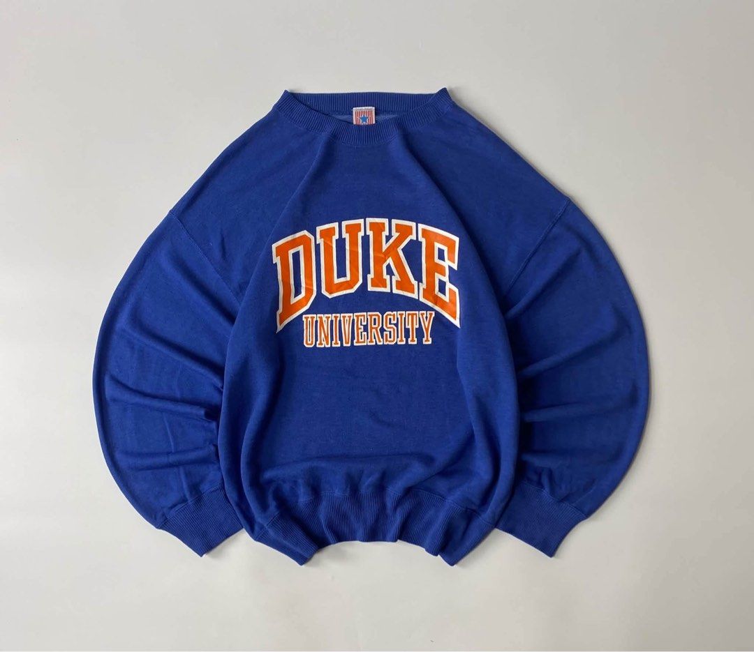 Vintage Duke University Blue Pullover Sweatshirt (Category: Coats, Jackets and Outerwear) located in Luna. Submitted by wescart (Listing ID 1468908724, Image 1). Description: width:23.5 length:26.5 Large on tag Boxy fit Color rate: 9.8/10 Issue:none VeryGood Condition.