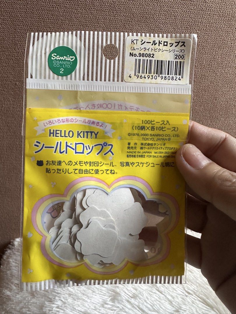 Vintage Hello Kitty "Moonlight Pixie" Seal Drops (ハローキティ シールドロップス) (Category: Character Goods) located in Davao. Submitted by favoritepreloved (Listing ID 1468766911, Image 3). Description: 10 designs, 10 pieces of each, originally priced at ¥200 in Japan. 💜100-piece flake sticker set, was released by Sanrio in the year 2000..