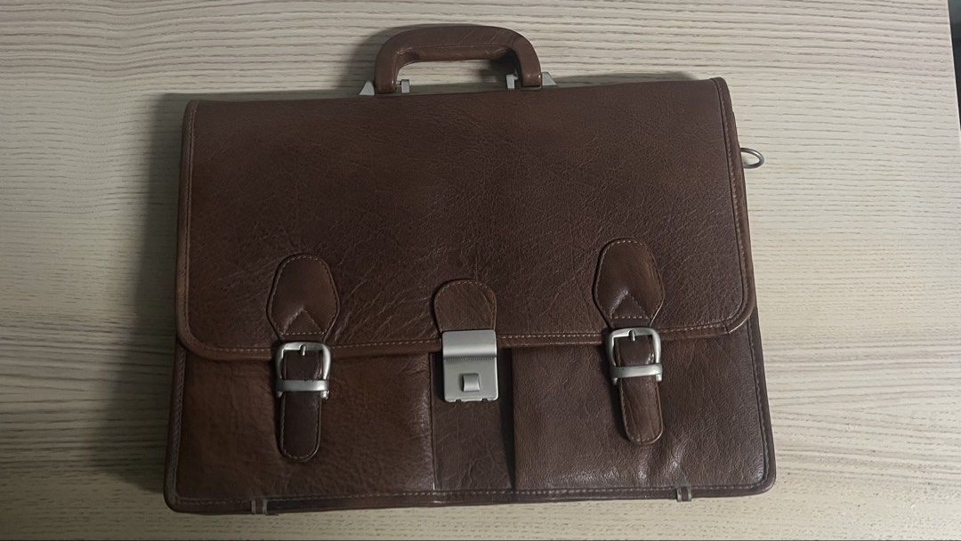 Vintage Leather Briefcase (Category: Briefcases) located in San Juan City. Submitted by scarfacee (Listing ID 1468869953, Image 1). Description: 90s Vintage Leather Briefcase Well maintained, rarely used No leather cracks Code lock Zippers working No issues Includes leather shoulder strap Open to offers Location: San Juan.