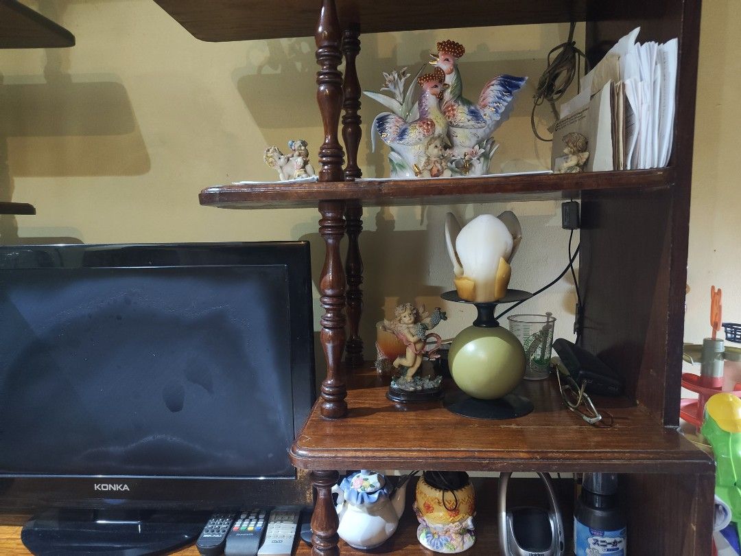 Vintage Narra Wood Multi-Tier Display Rack Shelving Unit (Category: Shelves, Cabinets & Racks) located in Quezon City. Submitted by KForYou_ph (Listing ID 1468803964, Image 3). Description: - Large wooden display rack with a rich dark brown finish - Unique asymmetrical shelf layout with turned support pillars - Sturdy and solid build, perfect for living rooms - Ample space for books, electronics, trinkets, and storage boxes - Ready for your home 