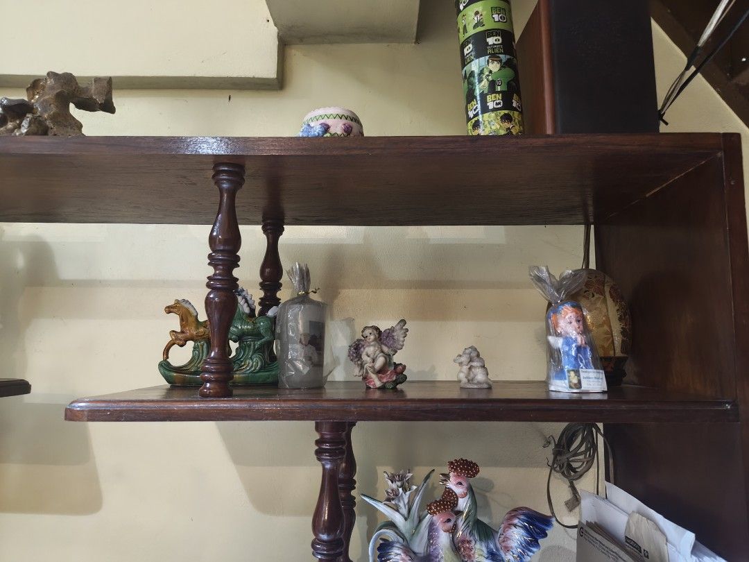 Vintage Narra Wood Multi-Tier Display Rack Shelving Unit (Category: Shelves, Cabinets & Racks) located in Quezon City. Submitted by KForYou_ph (Listing ID 1468803964, Image 2). Description: - Large wooden display rack with a rich dark brown finish - Unique asymmetrical shelf layout with turned support pillars - Sturdy and solid build, perfect for living rooms - Ample space for books, electronics, trinkets, and storage boxes - Ready for your home 