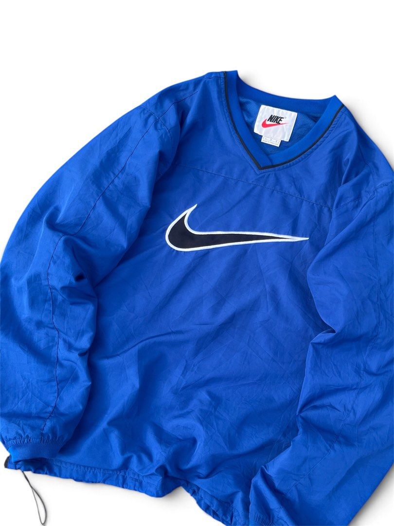 Vintage nike pullover windbreaker (Category: Coats, Jackets and Outerwear) located in Manila. Submitted by thrift_tg (Listing ID 1468919308, Image 2). Description: Vintage 90’s Nike Pullover Windbreaker Royal Blue / Black Center Swoosh Dimes: 24 x 28 Size: L on tag - fits L to XL (baggy fit) Color rate: 9.5/10 Condition: 9.5/10 - No Issue, Like New • Big center swoosh embroidery (black with white outline) • V-neck pullover windbreaker • Drawstrin