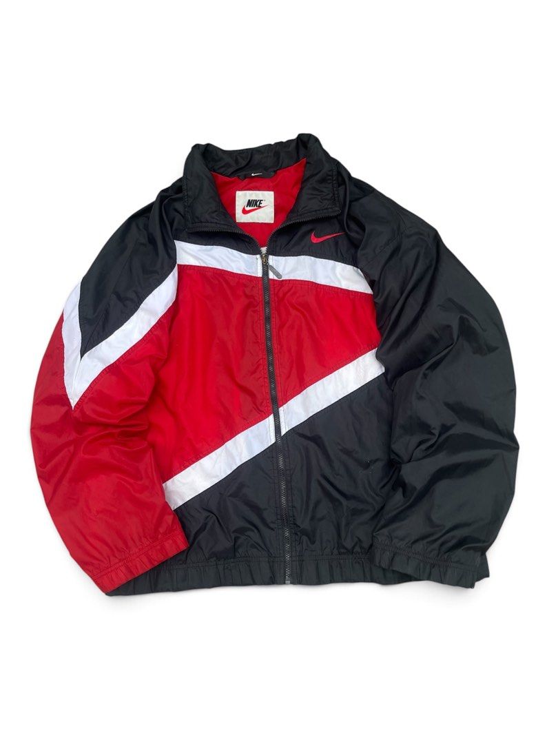 Vintage nike windbreaker (Category: Coats, Jackets and Outerwear) located in Manila. Submitted by thrift_tg (Listing ID 1468918227, Image 2). Description: Vintage 90’s Nike Windbreaker Red / Black / White - Bulls Colorway Dimes: 26/28 Size: XL on tag Color rate: 9/10 Condition: 7.5/10 to 8/10 Issues: • Loose ribbing (maluwag na cuffs/hem - common sa vintage) • Loose stitching on big swoosh back embroidery - may konting slice/tanggal tahi sa white