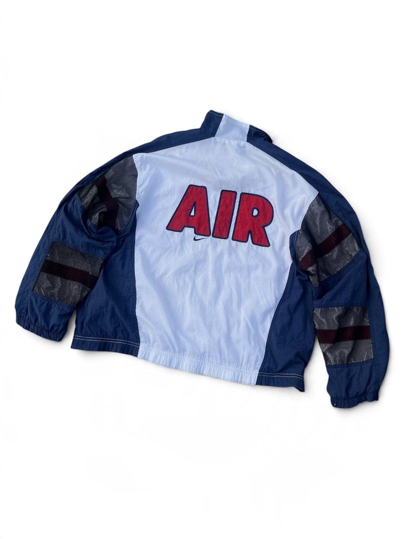 Vintage nike windbreaker (Category: Coats, Jackets and Outerwear) located in Manila. Submitted by thrift_tg (Listing ID 1468918855, Image 2). Description: Vintage 90’s Nike AIR Windbreaker Jacket White / Navy / Red Colorway Dimes: 25.5 x 26 Size: M on tag - fits M to L Color rate: 9/10 Condition: 8.5/10 Issue: Maluwag na ribbings sa cuffs/hem + may scratches sa ribbings (common sa vintage) - still wearable, not super noticeable when worn • Small 