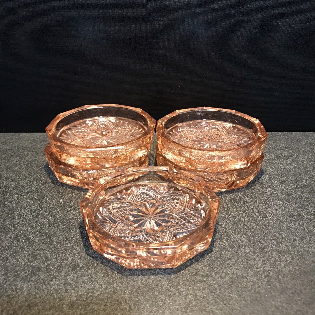 Vintage Pink Depression Glass Pressed Pattern Coasters Set (Category: Dinnerware & Cutlery) located in Baao. Submitted by all.things.japan (Listing ID 1468749154, Image 1). Description: - Set of 5 beautiful pink pressed glass coasters - Chic octagonal shape with intricate starburst pattern - Heavy and solid vintage glassware - Perfect for coffee tables, dining sets, or home styling - Message for inquiries or fast shipping!.