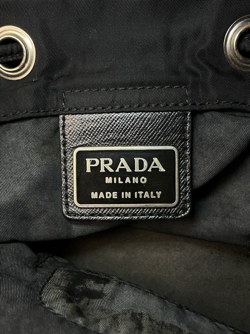 Vintage Prada Tessuto Nylon Mini Backpack (Category: Luxury Bags & Wallets) located in Manila. Submitted by streetsavvy (Listing ID 1468806006, Image 3). Description: Vintage Prada Tessuto Nylon Mini Backpack Width: 7” Height: 10” Depth: 5” Measured in Inches Crafted in Italy from durable nylon with signature Saffiano leather accents and silver-tone hardware featuring the iconic enamel triangle logo on the front zip pocket. Features a drawstring 
