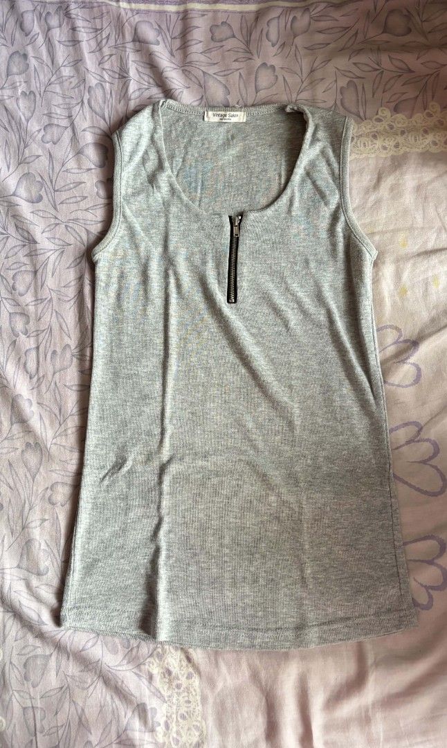 Vintage Salon Grey Zip Front Tank Top (Category: Sleeveless) located in Manila. Submitted by itz_zy (Listing ID 1468849895, Image 1). Description: - Brand: Vintage Salon - Color: Grey - Material: Ribbed knit - Design: Scoop neck with half-zip closure - Style: Simple everyday basic - Condition: Clean and ready to wear.