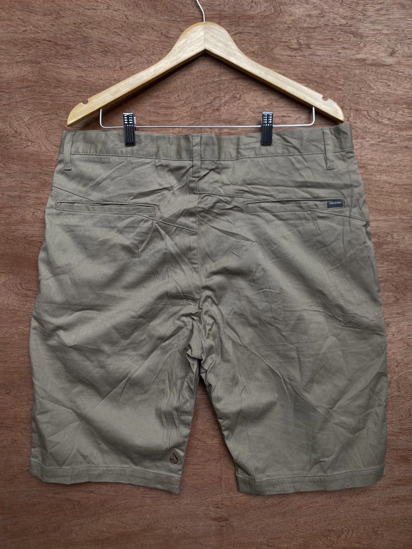 Volcom Chino Shorts Khaki Size 36 (Category: Shorts) located in Puerto Princesa. Submitted by earlpogitrhift (Listing ID 1468771730, Image 2). Description: - Brand: Volcom - Style: Chino Shorts - Color: Khaki Brown - Size: Men's 36 Length 23 - Material: Cotton blend - Details: Button fly closure, front/rear pockets, embroidered Volcom stone logo near hem - Condition: Clean inner lining and waistband tag - Perfect casual everyday staple.