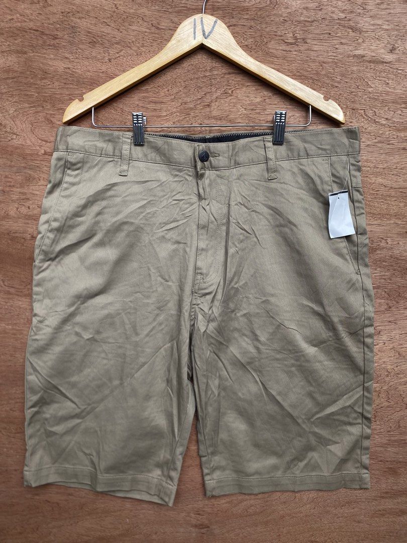 Volcom Chino Shorts Khaki Size 36 (Category: Shorts) located in Puerto Princesa. Submitted by earlpogitrhift (Listing ID 1468771730, Image 1). Description: - Brand: Volcom - Style: Chino Shorts - Color: Khaki Brown - Size: Men's 36 Length 23 - Material: Cotton blend - Details: Button fly closure, front/rear pockets, embroidered Volcom stone logo near hem - Condition: Clean inner lining and waistband tag - Perfect casual everyday staple.