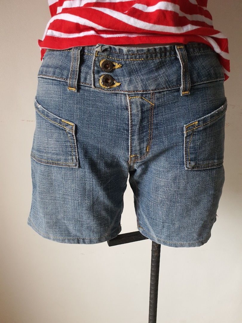 Von Dutch Denim Shorts (Category: Shorts) located in Meycauayan. Submitted by shoptoown (Listing ID 1468749235, Image 1). Description: - Brand: Von Dutch - Style: Classic Y2K denim shorts - Wash: Medium blue with yellow contrast stitching - Waist: ~14 inches across (flat lay) - Details: Double button closure, front pockets, and genuine leather back patch - Condition: Great for casual summer wear.
