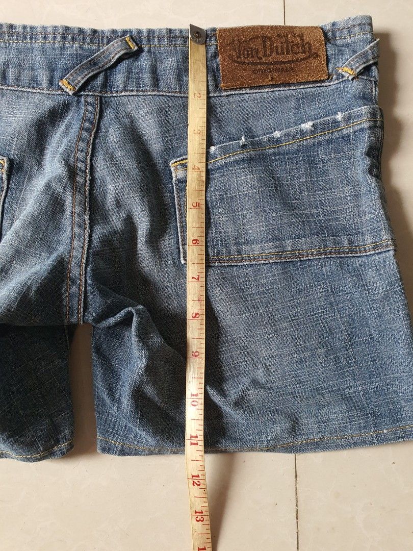 Von Dutch Denim Shorts (Category: Shorts) located in Meycauayan. Submitted by shoptoown (Listing ID 1468749235, Image 3). Description: - Brand: Von Dutch - Style: Classic Y2K denim shorts - Wash: Medium blue with yellow contrast stitching - Waist: ~14 inches across (flat lay) - Details: Double button closure, front pockets, and genuine leather back patch - Condition: Great for casual summer wear.