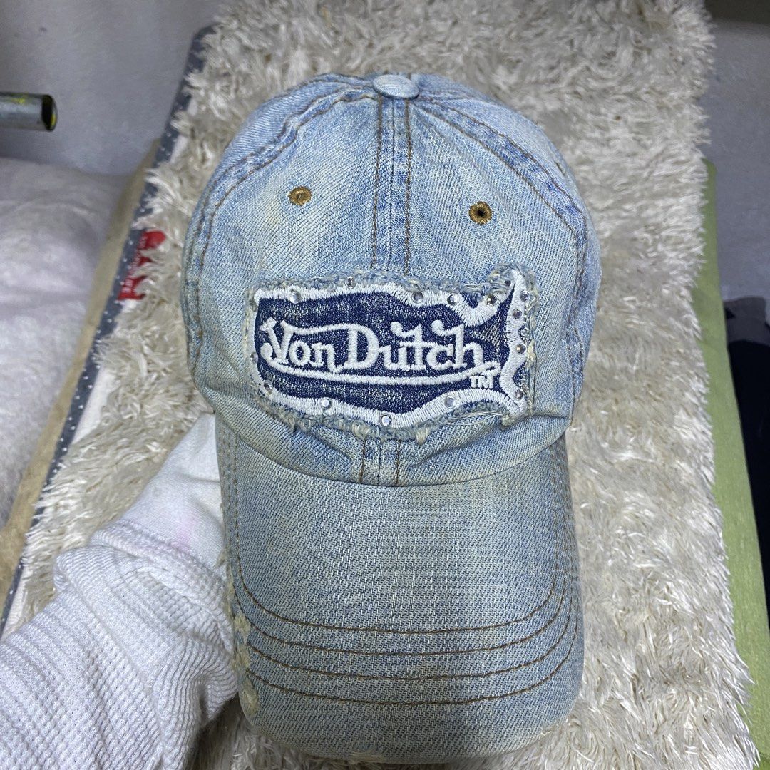 Von Dutch Denim y2k Cap (Category: Caps & Hats) located in Cagayan de Oro. Submitted by neoazai (Listing ID 1468817307, Image 1). Description: - Brand: Von Dutch - Style: Classic Y2K baseball cap - Color/Material: Light blue denim - Details: Distressed front patch with rhinestone border - Fit: Adjustable leather strap with metal buckle - Authenticity: Includes Kustommade Originals tag inside - Condition: Brand new / Excellent.