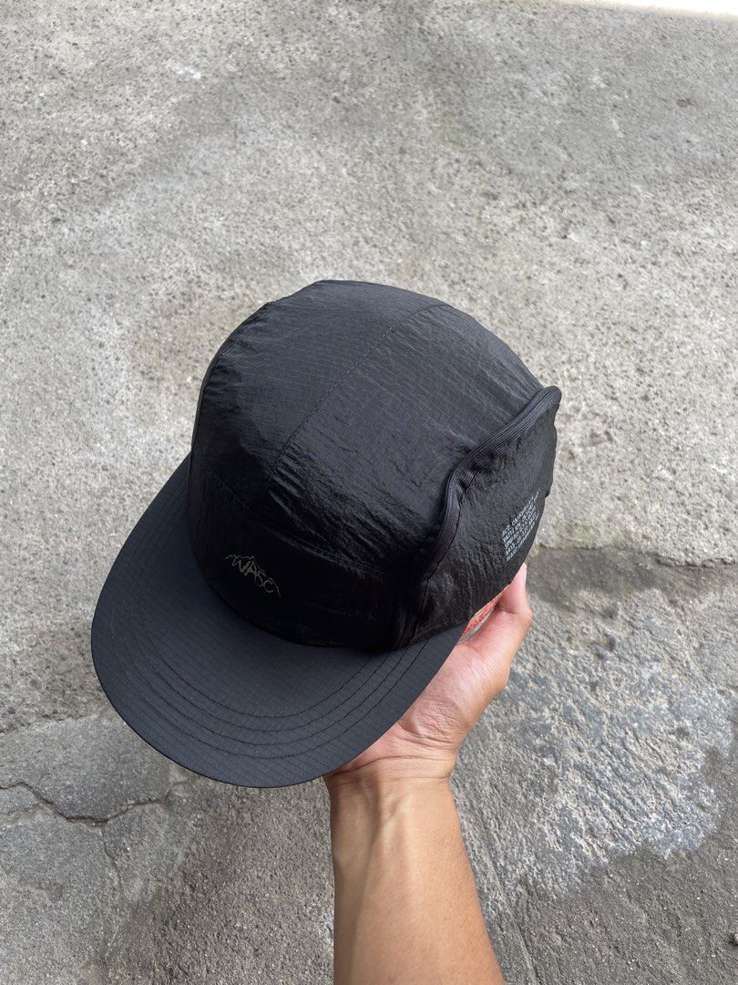 WASC Headwear Black 5-Panel Cap (Category: Caps & Hats) located in General Santos City (Dadiangas). Submitted by christbluee (Listing ID 1468827294, Image 2). Description: - Brand: Wasc Headwear - Style: Black 5-panel cap - Material: Lightweight crinkled nylon - Details: Embroidered mountain logo on front, utility text print on side, metal ventilation eyelets - Closure: Adjustable bungee cord with toggle - Condition: Clean overall.