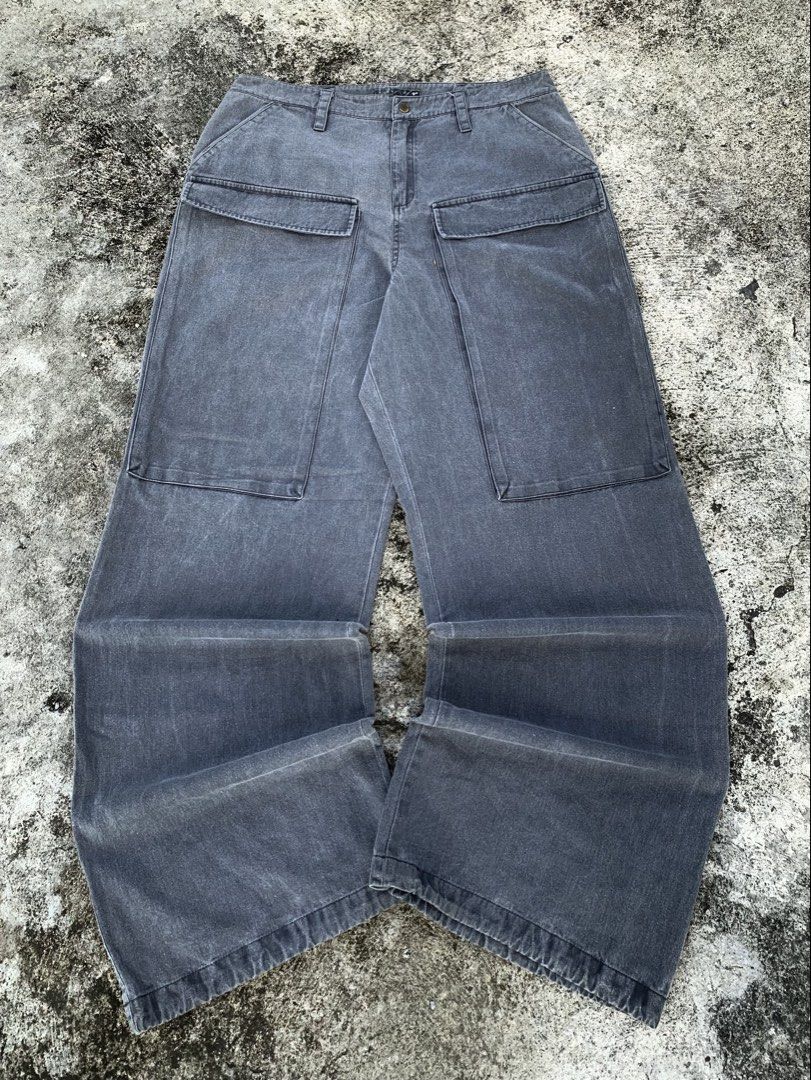 Washed Charcoal Grey Wide Leg Cargo Pants (Category: Jeans) located in Manila. Submitted by fiercefox.4ae806 (Listing ID 1468879766, Image 1). Description: - Color/Wash: Washed charcoal grey with a heavy faded texture - Fit: Oversized wide leg, straight through the thigh with clean hems - Rise/Closure: Mid-rise waist with zip fly and metal button closure - Details: Distinct front pocket panels and stylish panel stitching down the legs - Material: