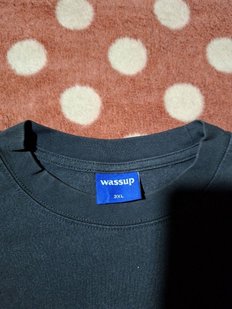 Wassup Black World Map Graphic Tee Size 3XL (Category: Tshirts & Polo Shirts ) located in Rizal. Submitted by thrifthings_10 (Listing ID 1468880683, Image 3). Description: - Size: 3XL (Relaxed oversized fit) - Color: Black - Design: Small 'Wassup' chest print, large colorful world map back print - Details: Blue brand tags on collar interior and lower right hem - Style: Short sleeves, crew neck -Condition: Good fading .