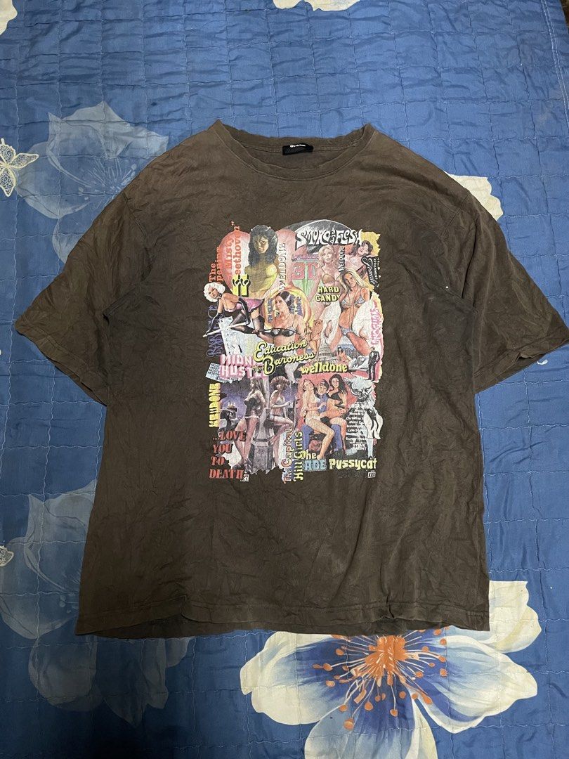 We11done Collage Graphic T-Shirt Brown (Category: Tshirts & Polo Shirts ) located in Manila. Submitted by chawmichael (Listing ID 1468879572, Image 1). Description: - Brand: We11done - Color/Style: Washed brown with vintage dye effect - Design: Large retro movie and pin-up collage print on front - Branding: Big 'WE11DONE' print across upper back and small woven label near lower hem - Fit: Crew neck with relaxed short sleeves - Condition: Excellen