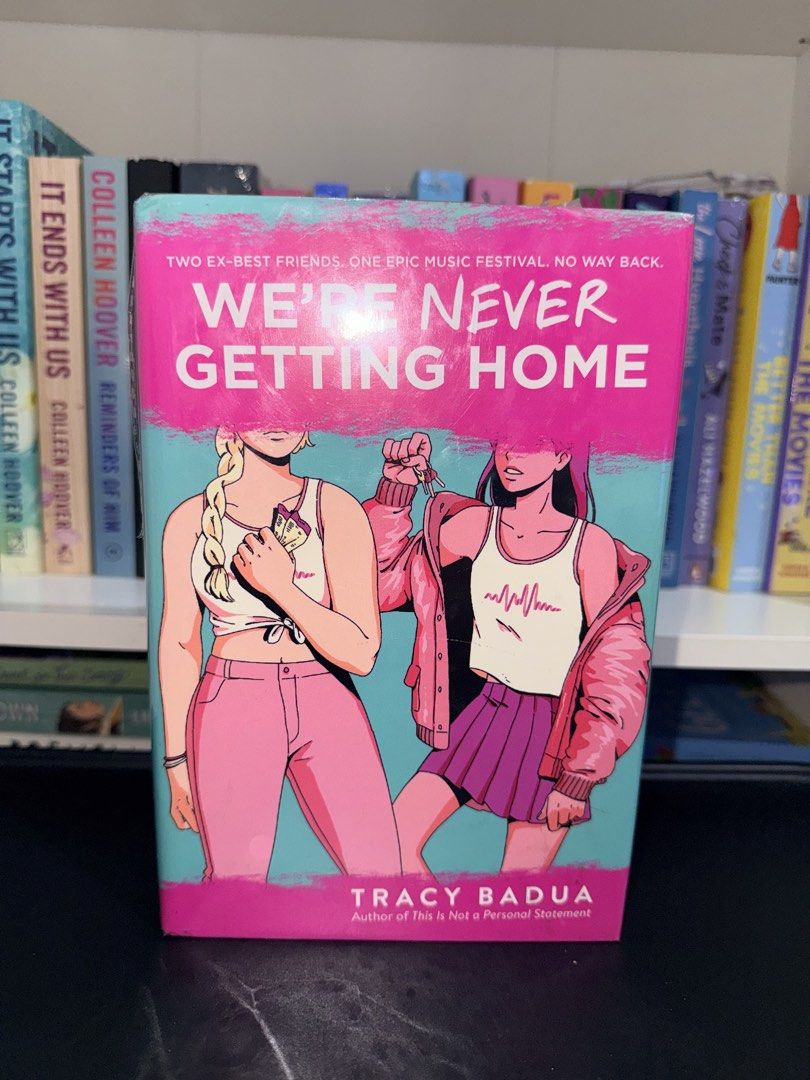 We're Never Getting Home by Tracy Badua (Category: Storybooks) located in Manila. Submitted by booksingshelf (Listing ID 1468758510, Image 1). Description: - Title/Author: Young adult thriller by Tracy Badua - Plot: Two ex-best friends reunite at a music festival with thrilling consequences - Format: Paperback with eye-catching pink and blue cover art - Condition: Clean pages and a solid, intact spine - Perfect for: Fans of contemporary YA fictio